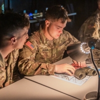 Scout teams from across the globe compete in the 2025 Gainey Cup Best Scout Squad Competition in the Call for Fire event April 28, 2025, at Clarke Simulation Center, on Fort Benning, Georgia. During the Call for Fire event, Scout teams conduct missions by calling for fire on simulated targets. (U.S. Army photo by Joey Rhodes II)