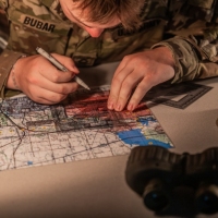Scout teams from across the globe compete in the 2025 Gainey Cup Best Scout Squad Competition in the Call for Fire event April 28, 2025, at Clarke Simulation Center, on Fort Benning, Georgia. During the Call for Fire event, Scout teams conduct missions by calling for fire on simulated targets. (U.S. Army photo by Joey Rhodes II)