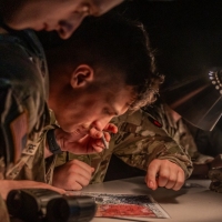 Scout teams from across the globe compete in the 2025 Gainey Cup Best Scout Squad Competition in the Call for Fire event April 28, 2025, at Clarke Simulation Center, on Fort Benning, Georgia. During the Call for Fire event, Scout teams conduct missions by calling for fire on simulated targets. (U.S. Army photo by Joey Rhodes II)