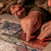 Scout teams from across the globe compete in the 2025 Gainey Cup Best Scout Squad Competition in the Call for Fire event April 28, 2025, at Clarke Simulation Center, on Fort Benning, Georgia. During the Call for Fire event, Scout teams conduct missions by calling for fire on simulated targets. (U.S. Army photo by Joey Rhodes II)