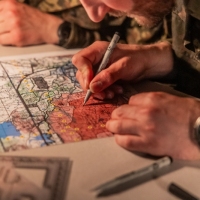 Scout teams from across the globe compete in the 2025 Gainey Cup Best Scout Squad Competition in the Call for Fire event April 28, 2025, at Clarke Simulation Center, on Fort Benning, Georgia. During the Call for Fire event, Scout teams conduct missions by calling for fire on simulated targets. (U.S. Army photo by Joey Rhodes II)