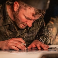 Scout teams from across the globe compete in the 2025 Gainey Cup Best Scout Squad Competition in the Call for Fire event April 28, 2025, at Clarke Simulation Center, on Fort Benning, Georgia. During the Call for Fire event, Scout teams conduct missions by calling for fire on simulated targets. (U.S. Army photo by Joey Rhodes II)